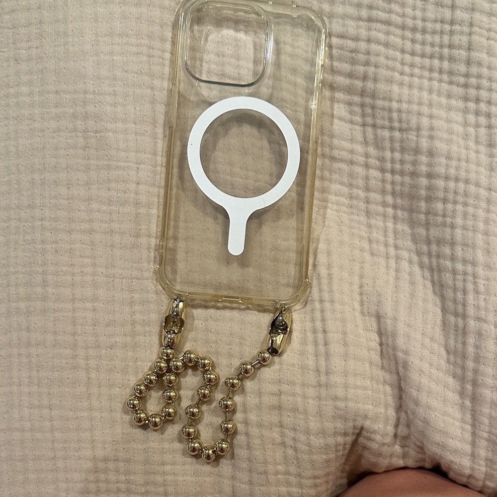 OSSA New York iPhone 14 Pro with gold ball chain